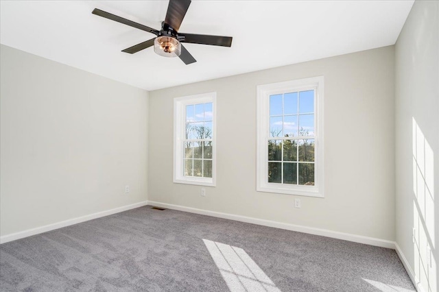 unfurnished room with light carpet and ceiling fan