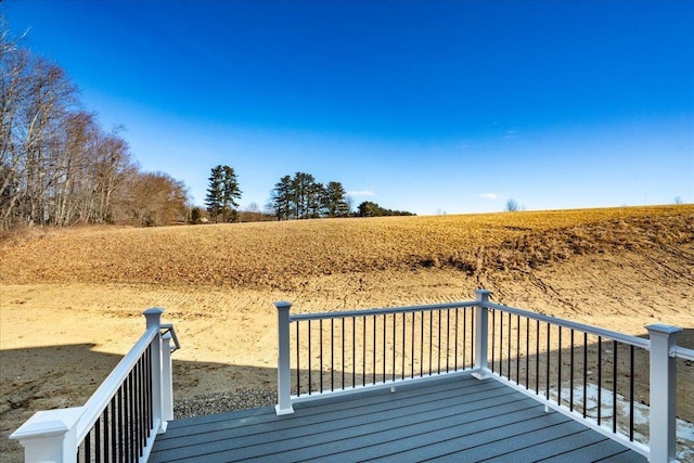 wooden terrace with a rural view