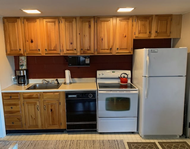 kitchen with white appliances and sink