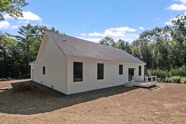 back of house with a wooden deck