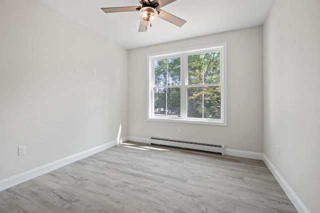 unfurnished room with light wood-type flooring, ceiling fan, and baseboard heating