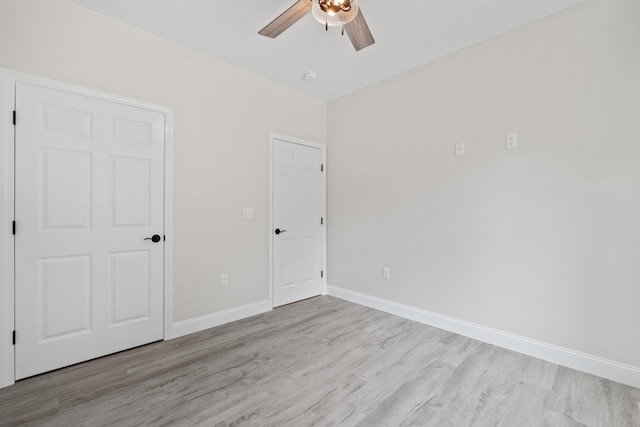 unfurnished bedroom featuring ceiling fan and light wood-type flooring