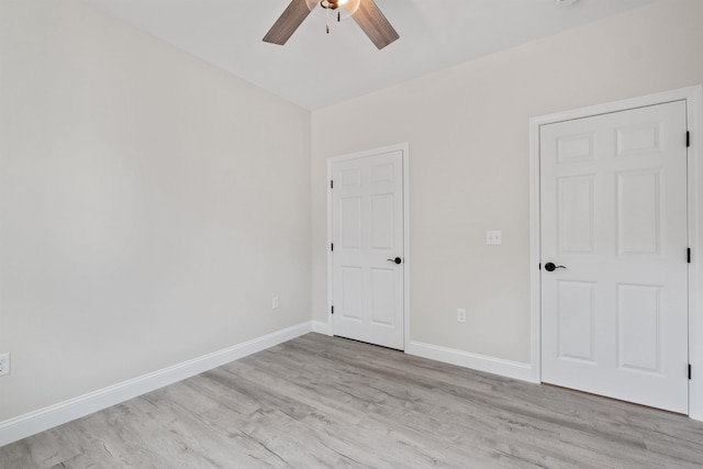 unfurnished room featuring ceiling fan and light hardwood / wood-style flooring