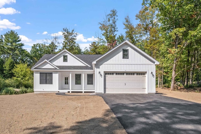 modern farmhouse featuring a garage