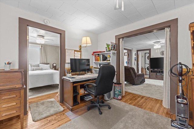 office area with ceiling fan and light wood-type flooring