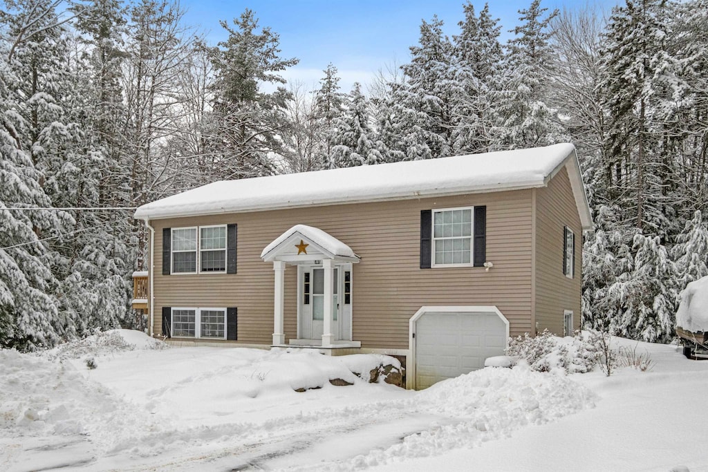 bi-level home featuring a garage