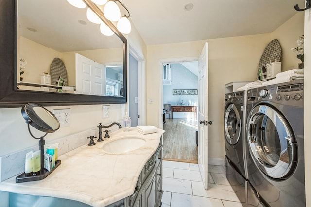 bathroom featuring independent washer and dryer and vanity