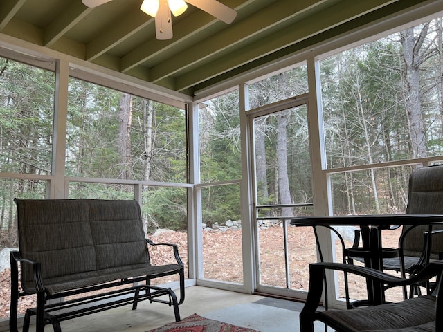 sunroom featuring ceiling fan