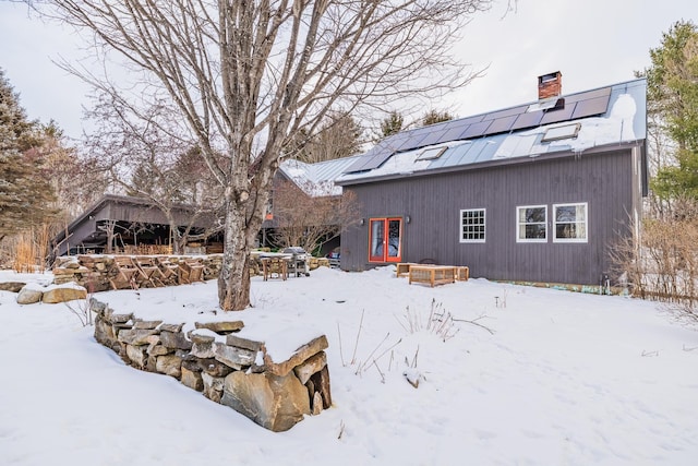 view of snow covered house