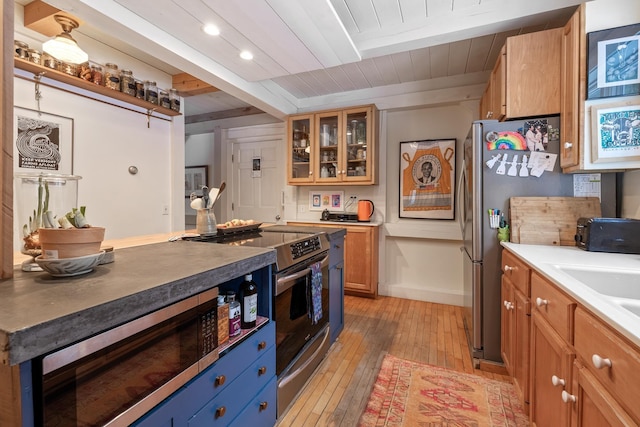 kitchen with sink, light hardwood / wood-style flooring, stainless steel appliances, wooden ceiling, and beamed ceiling