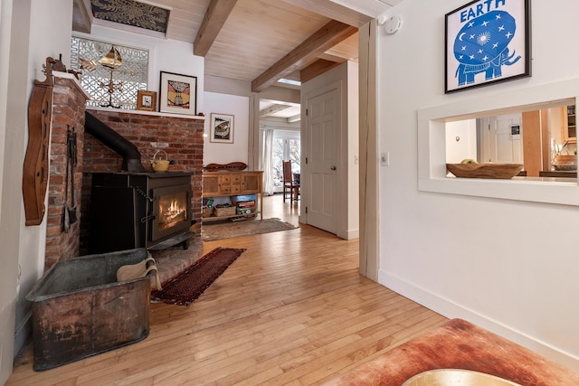 hall with beam ceiling and light hardwood / wood-style flooring