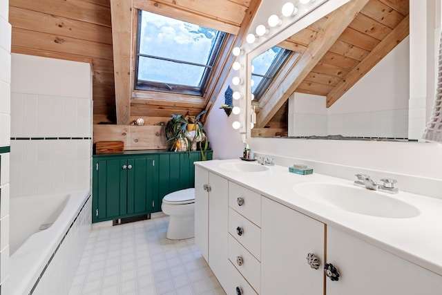 bathroom featuring vaulted ceiling with skylight, vanity, toilet, a bath, and wooden ceiling