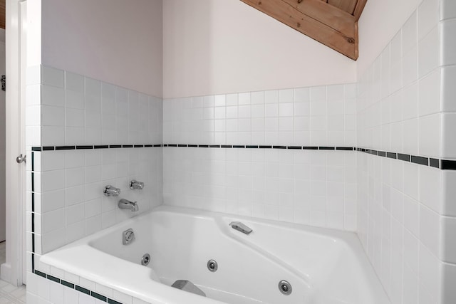 bathroom featuring a relaxing tiled tub