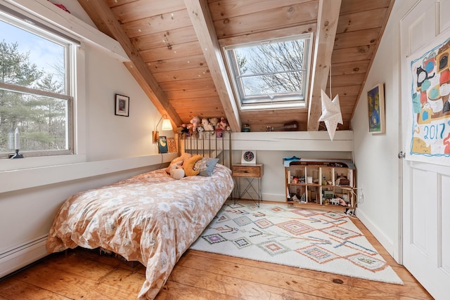 bedroom with hardwood / wood-style flooring, lofted ceiling, a baseboard heating unit, and wood ceiling