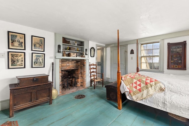 bedroom with a brick fireplace