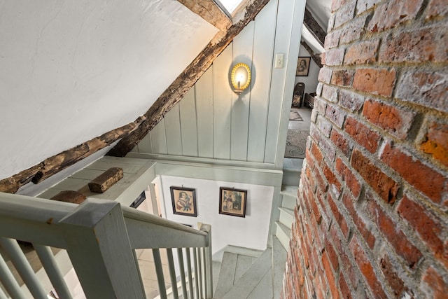 stairway with brick wall