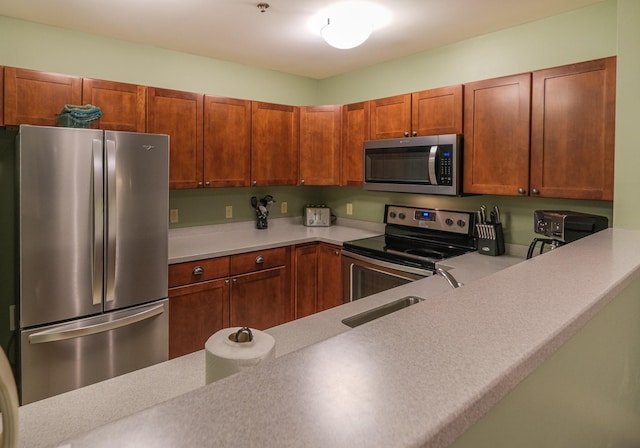 kitchen featuring appliances with stainless steel finishes and sink