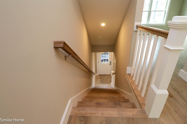 staircase featuring hardwood / wood-style flooring