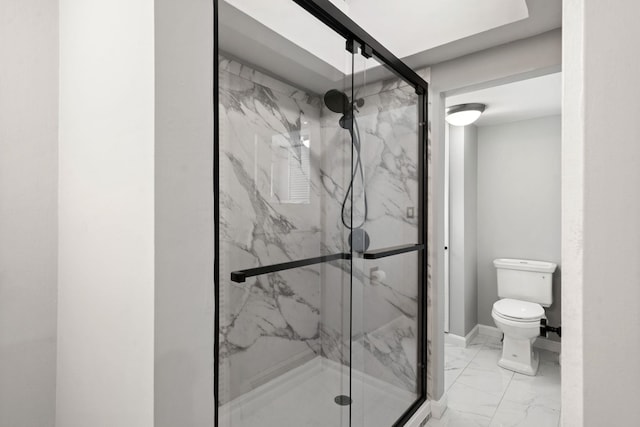 bathroom featuring an enclosed shower and toilet