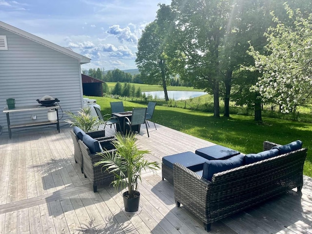 view of patio / terrace with a deck with water view and outdoor lounge area