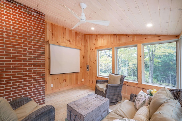 living room with light hardwood / wood-style flooring, wood ceiling, vaulted ceiling, and wood walls