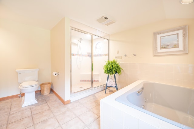 bathroom with vaulted ceiling, tile patterned floors, plus walk in shower, and toilet