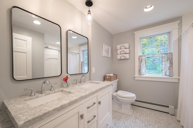 bathroom with vanity, a baseboard heating unit, tile patterned floors, and toilet