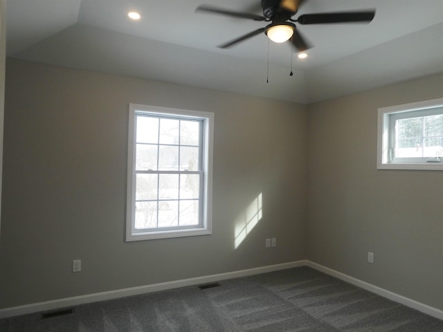 carpeted spare room with ceiling fan