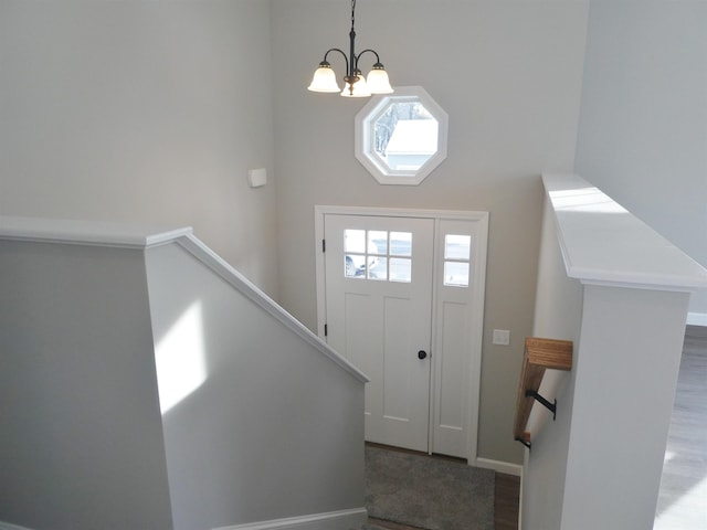 entrance foyer featuring a notable chandelier and hardwood / wood-style floors