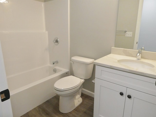 full bathroom with vanity, toilet, shower / bath combination, and hardwood / wood-style floors