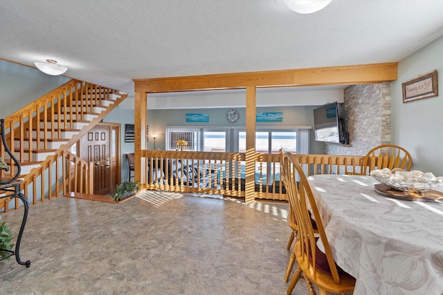 dining room with a textured ceiling