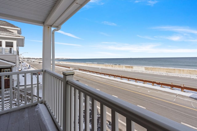 exterior space featuring a beach view and a water view