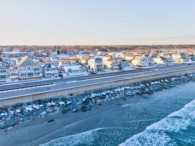 aerial view featuring a water view and a view of the beach