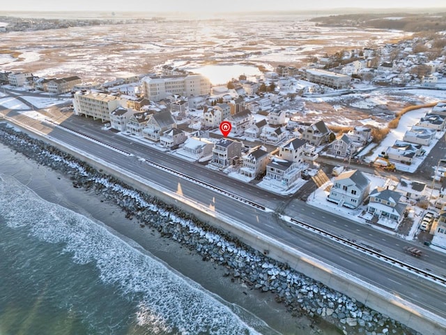 bird's eye view with a water view and a view of the beach