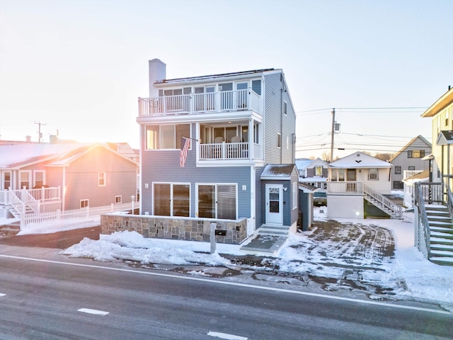 view of front of property with a balcony