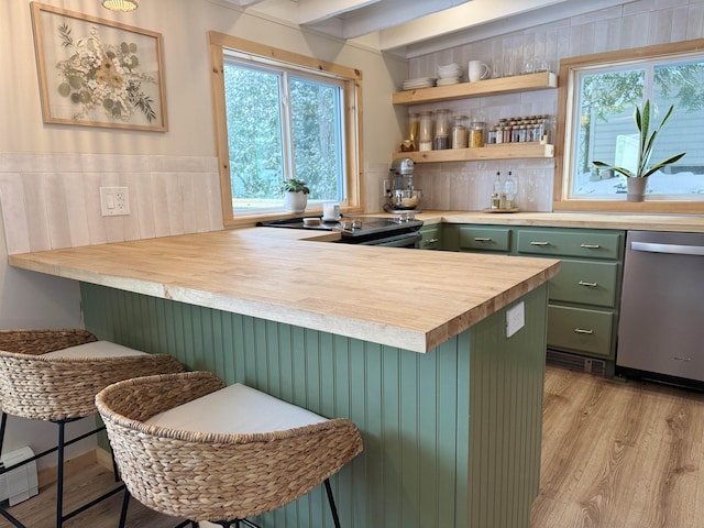 bar featuring butcher block countertops, green cabinets, backsplash, stainless steel dishwasher, and light wood-type flooring