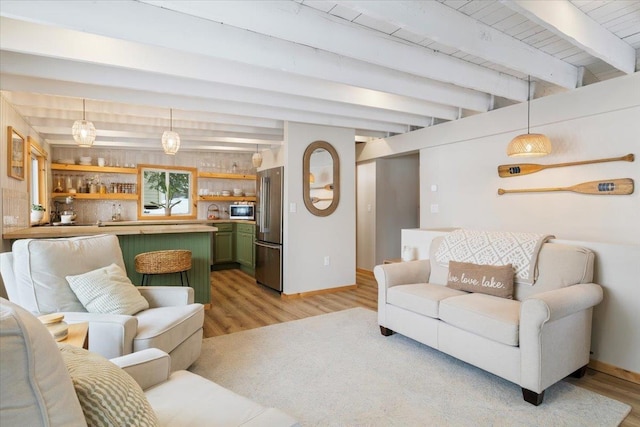 living room featuring indoor bar, beam ceiling, and light hardwood / wood-style flooring