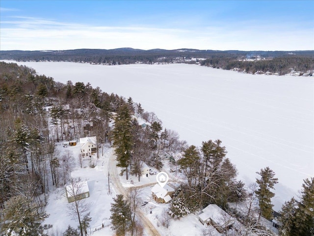 snowy aerial view featuring a mountain view