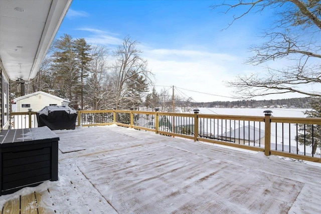 snow covered deck with area for grilling