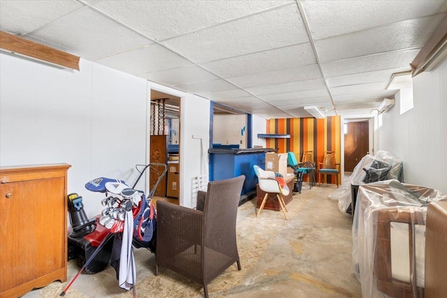 basement featuring a drop ceiling