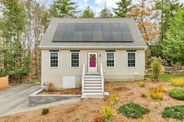 view of front of property with solar panels