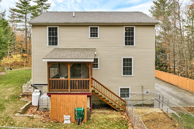 back of house with a sunroom