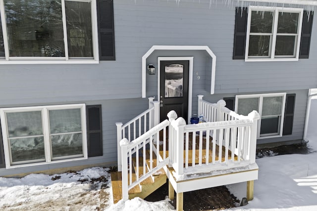 view of snow covered property entrance