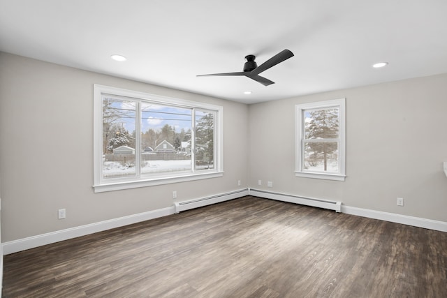 unfurnished room featuring dark hardwood / wood-style flooring, ceiling fan, and a healthy amount of sunlight