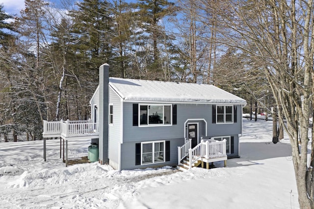 raised ranch featuring a wooden deck