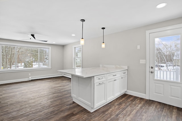 kitchen with pendant lighting, dark wood-type flooring, light stone countertops, and white cabinets