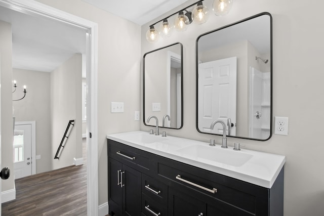 bathroom with hardwood / wood-style flooring and vanity