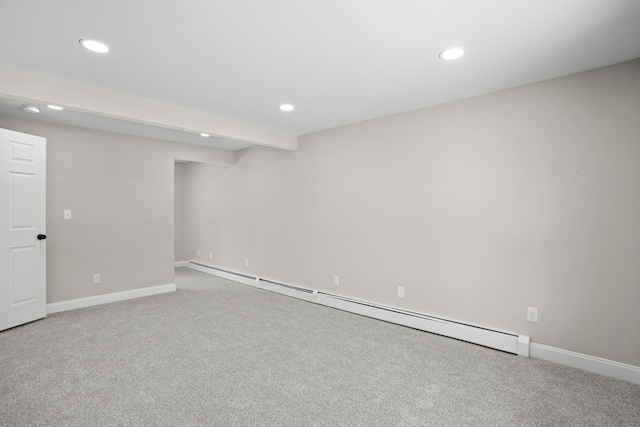 basement with carpet floors and baseboard heating