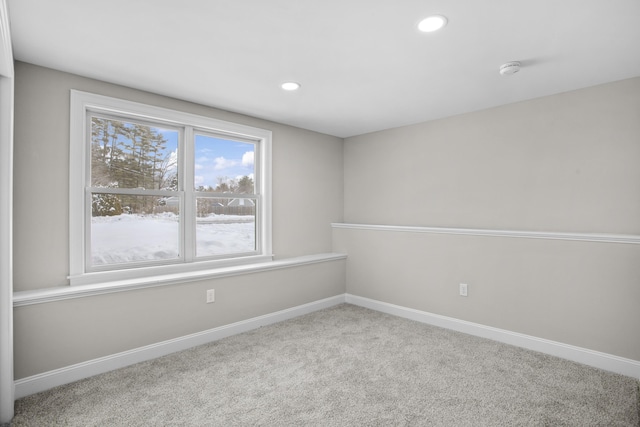 empty room featuring light colored carpet