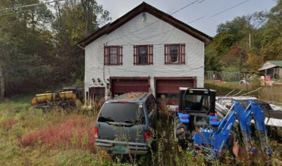 view of property exterior with a garage